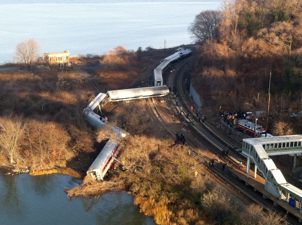 Cars from a Metro-North passenger train are scattered after the train derailed in the Bronx borough of New York on Sunday.