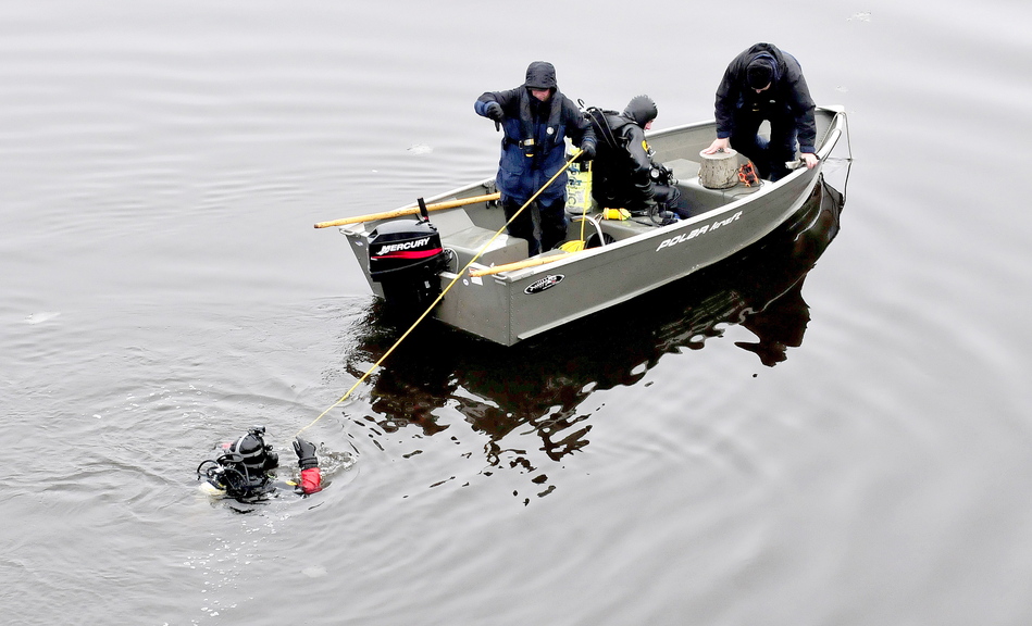 UNDERWATER SEARCH: Divers search in the Kennebec River in Waterville Monday for evidence in the recent homicide of a Waterville man. The man accused of the murder of Thomas Namer may have been on the Two-Cent Bridge or near it within hours of the killing, according to police.