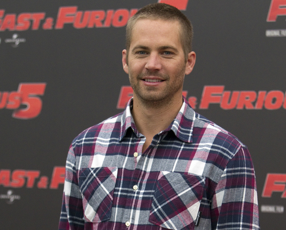 Actor Paul Walker poses for a publicity photo for the movie “Fast and Furious 5” in this April 2011 photo.