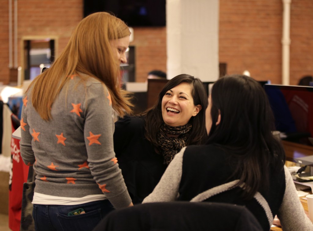 Shirin Majid, center, talks to co-workers at Quirky headquarters in New York recently. Majid, a new mother, recently took advantage of the company’s “blackout week” policy in which employees may take off one week a quarter. Company founder and CEO Ben Kaufman instituted the policy to experiment with ways for people to work smarter and to prevent burnout.