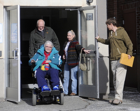 ON THE MOVE: Religious and union leaders from Kennebec County emerge Wednesday from a meeting with Stefanie Nadeau, of MaineCare Services, in Augusta to talk about the plight of their parishioners and members who have had trouble getting rides to their medical appointments.