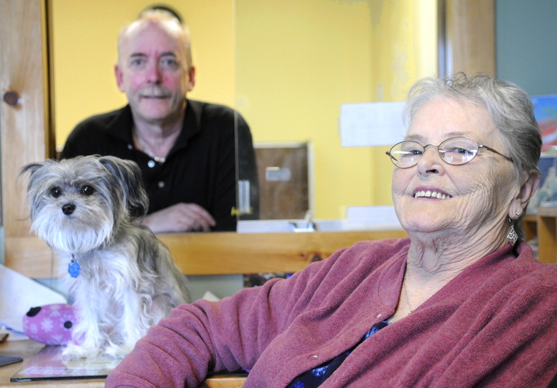 retiring: Mike and Lynda McFarland, shown here with their dog, Moka, who joins them at work daily, plan to retire Dec. 20 as Greyhound bus agents. The couple have sold tickets for 35 years in Augusta, currently at the Augusta State Airport.
