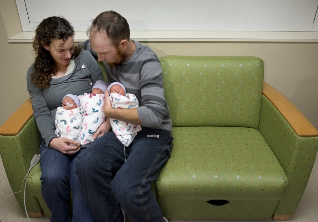 Hannah and Tom Hepner hold their newborn triplets in a self-care room at Sutter Memorial Hospital on Wednesday in Sacramento, Calif.