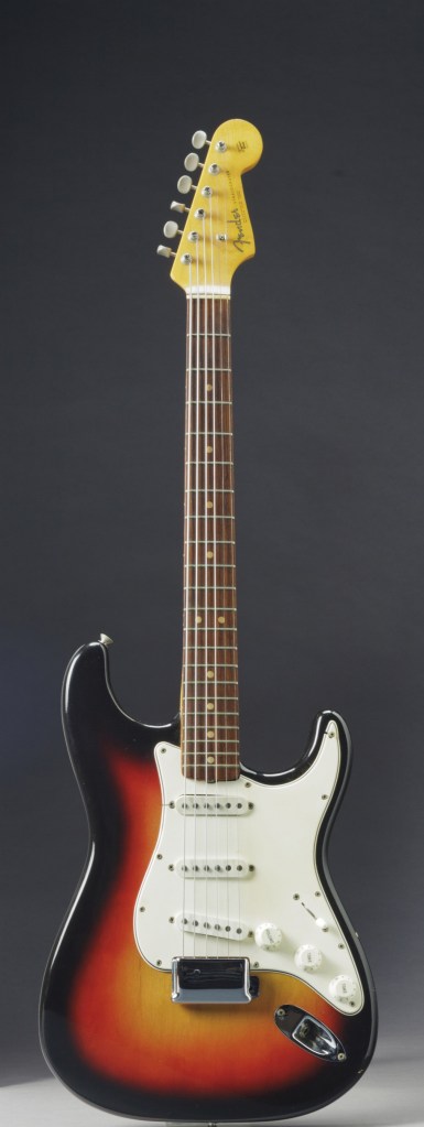 In this undated photo provided by Christie’s Auction House, the Fender Stratocaster a young Bob Dylan played at the historic 1965 Newport Folk Festival is shown. It sold at auction for close to $1 million.