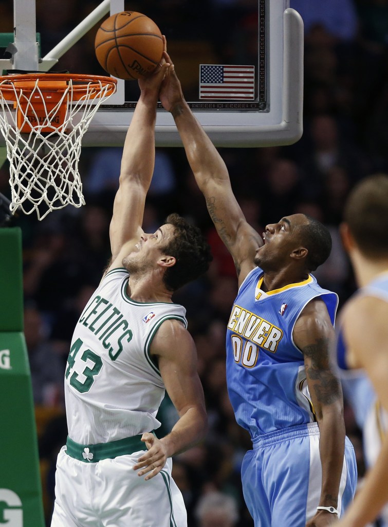 BLOCKED: Denver Nuggets’ Darrell Arthur (00) blocks a shot by Boston Celtics’ Kris Humphries (43) in the second quarter of a game on Friday in Boston.