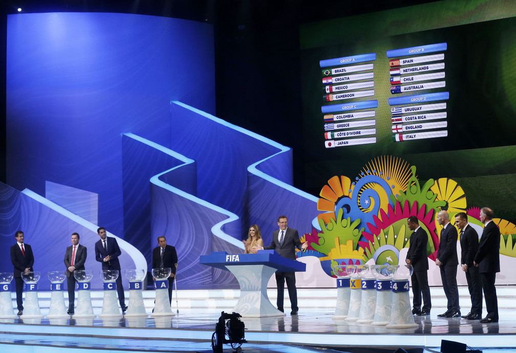 Groups A to D are displayed on a video screen during the draw ceremony for the 2014 soccer World Cup in Costa do Sauipe near Salvador, Brazil, Friday, Dec. 6, 2013.