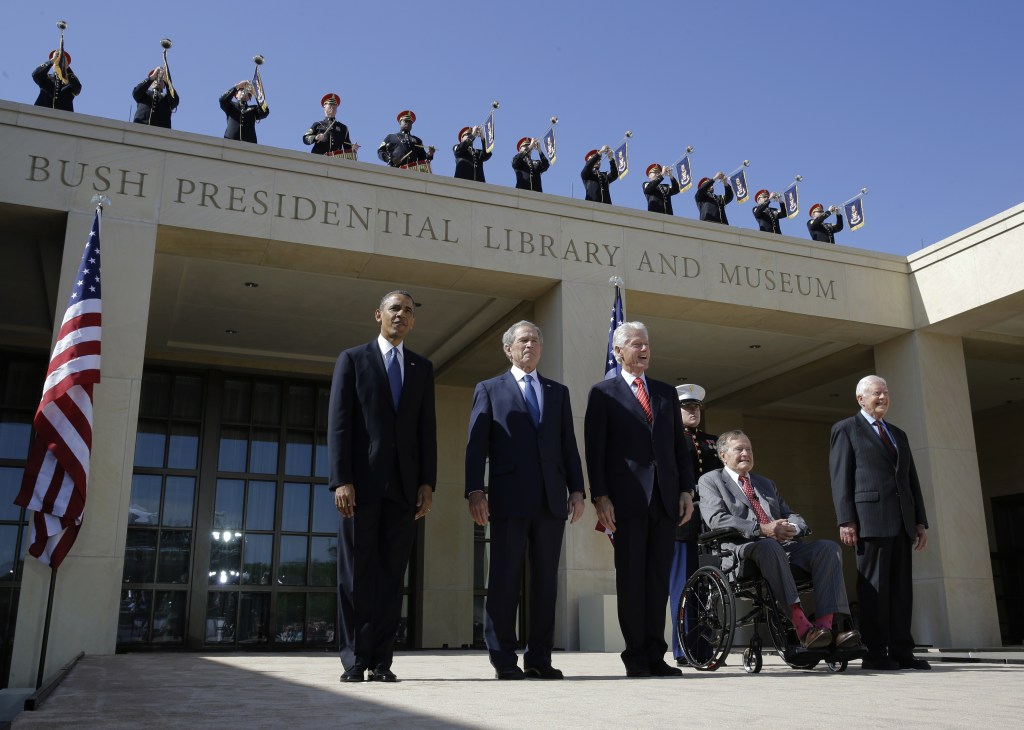 In this April 2013 file photo, from left, President Barack Obama, former president George W. Bush, former president William J. Clinton, former President George H.W. Bush and former president Jimmy Carter arrive for the dedication of the George W. Bush Presidential Center Thursday, April 25, 2013, in Dallas. Presidents Obama and Clinton, and George W, Bush, will travel to South Africa to attend memorial services for Nelson Mandela.