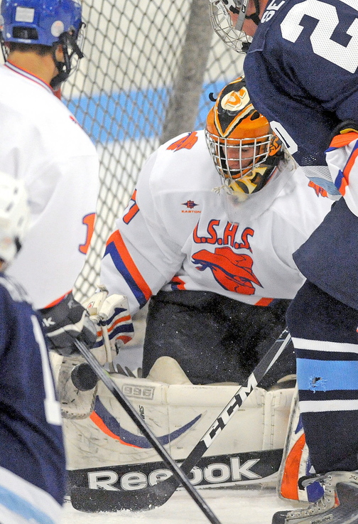 SAVE: Lawrence/Skowhegan goalie Sam Edmondson makes a save against Presque Isle in the season opener for both teams Friday at Sukee Arena in Winslow.