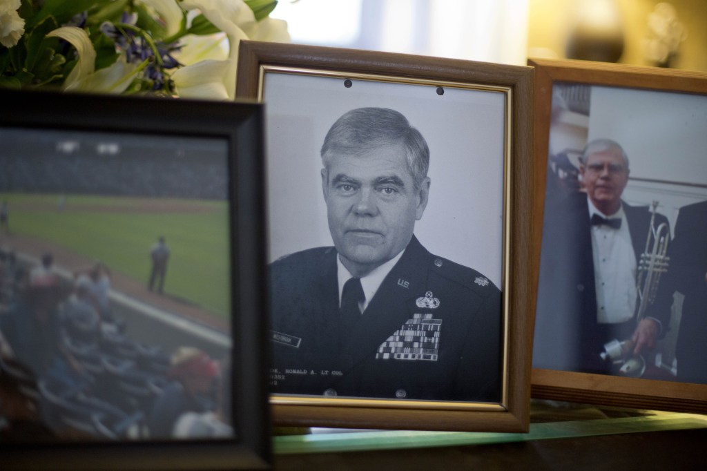 A photo of Ret. Lt. Col. Ronald Westbrook sits on the coffee table in his home, Thursday, Dec. 5, in Chickamauga, Ga. His life ended when he wandered away from home, pounded on a stranger’s door and was shot and killed by the resident.