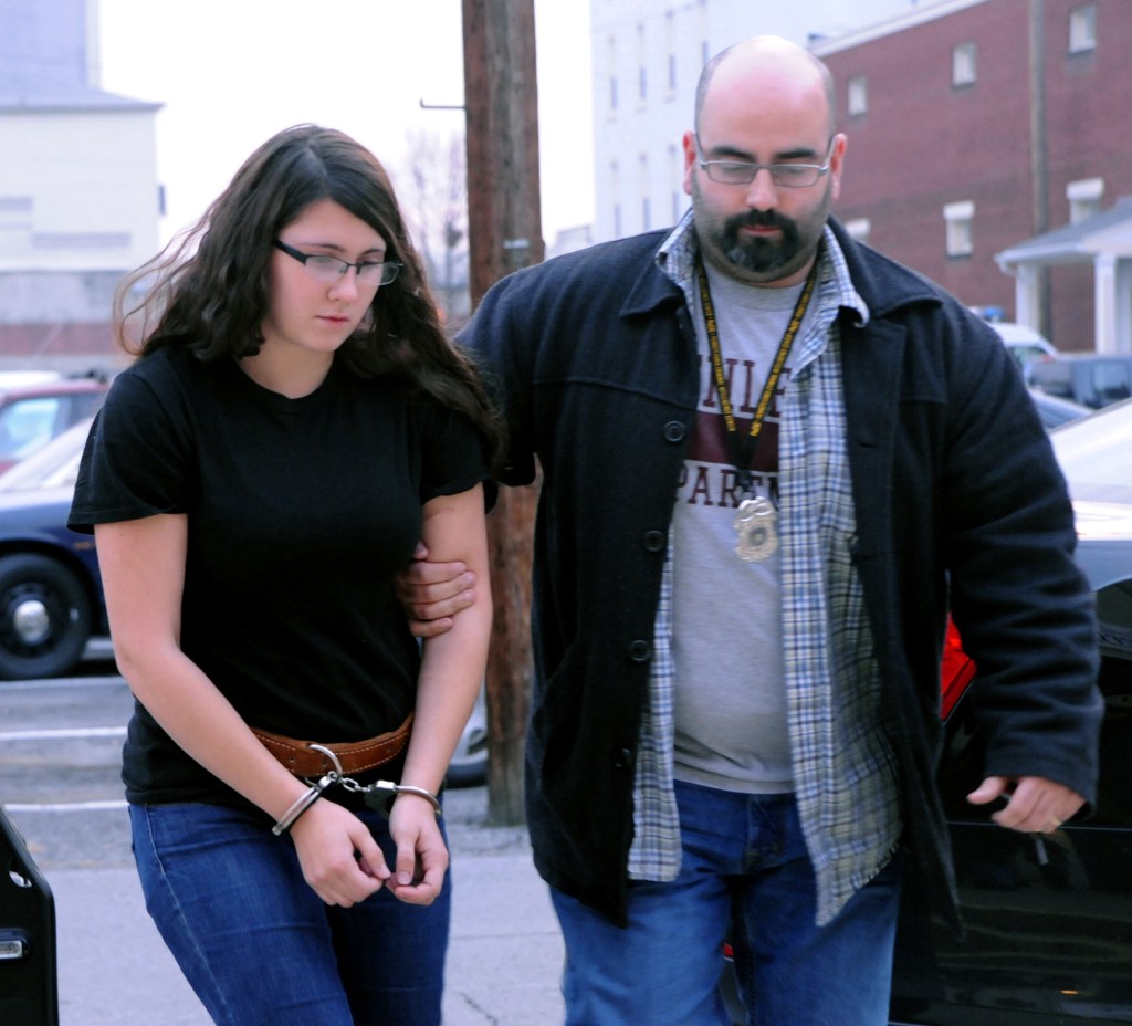 Miranda K. Barbour is led into District Judge Ben Apfelbaum’s office in Sunbury, Pa., Tuesday by Sunbury policeman Travis Bremigen. Barbour is charged in the murder of Troy LaFerrara, whose body was found in a backyard in Sunbury in November.