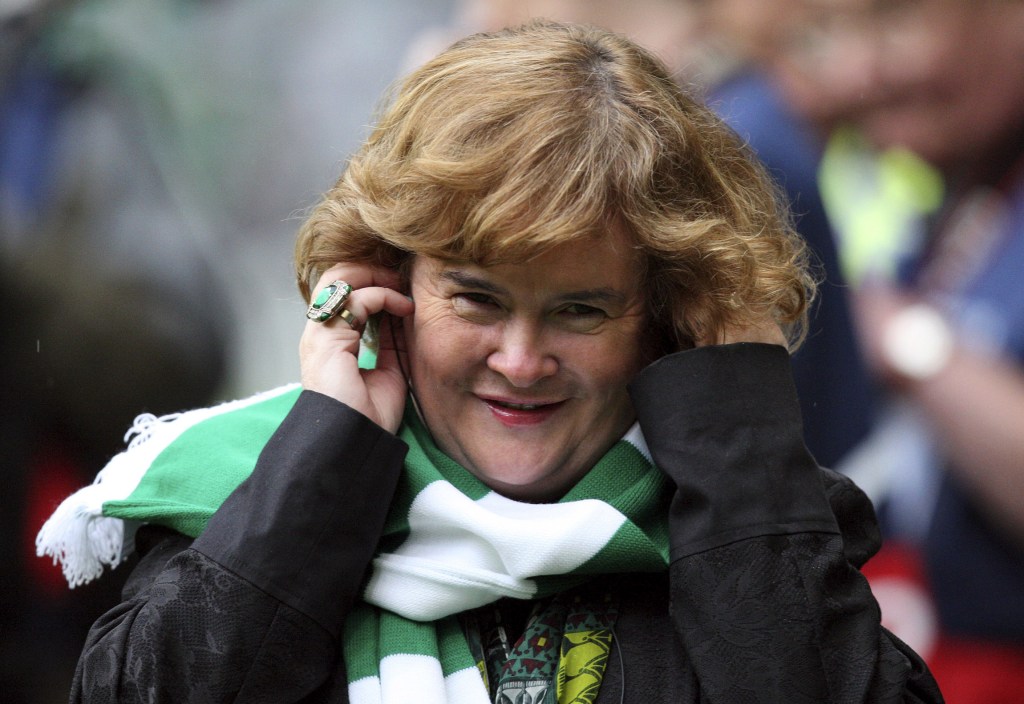 FILE - Susan Boyle performs ahead of the Champions League qualifying second round soccer match between Celtic and Helsingborgs at Celtic Park, Glasgow, Scotland, in this Aug. 29, 2012 file photo. Boyle told the Observer newspaper in an interview published Sunday Dec. 8, 2013, she has been diagnosed with Asperger’s syndrome, a form of autism, after seeing a specialist a year ago.