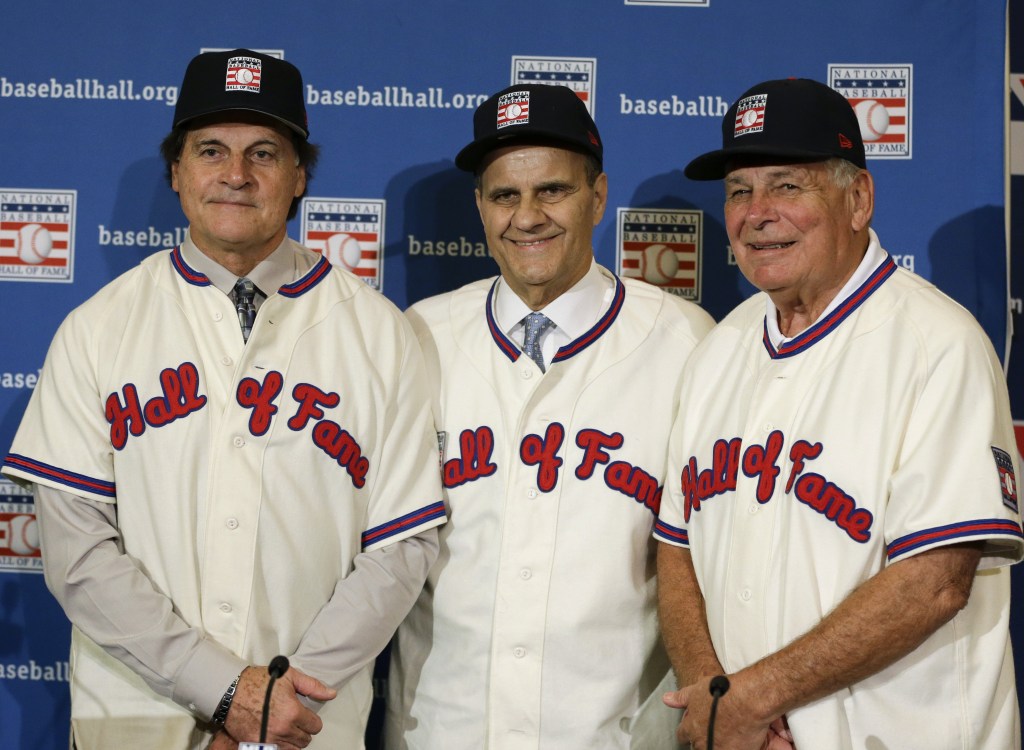 Retired managers, from left, Tony La Russa, Joe Torre and Bobby Cox gather for a photo after it was announced that they were unanimously elected to the baseball Hall of Fame, at a news conference during MLB winter meetings in Lake Buena Vista, Fla., Monday, Dec. 9, 2013.