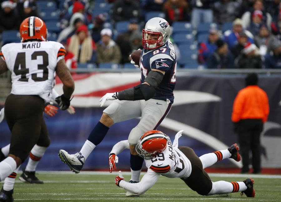 New England Patriots tight end Rob Gronkowski is tackled by Cleveland Browns cornerback Leon McFadden during the third quarter of Sunday's game in Foxborough, Mass. Gronkowski suffered a season-ending injury during the game.