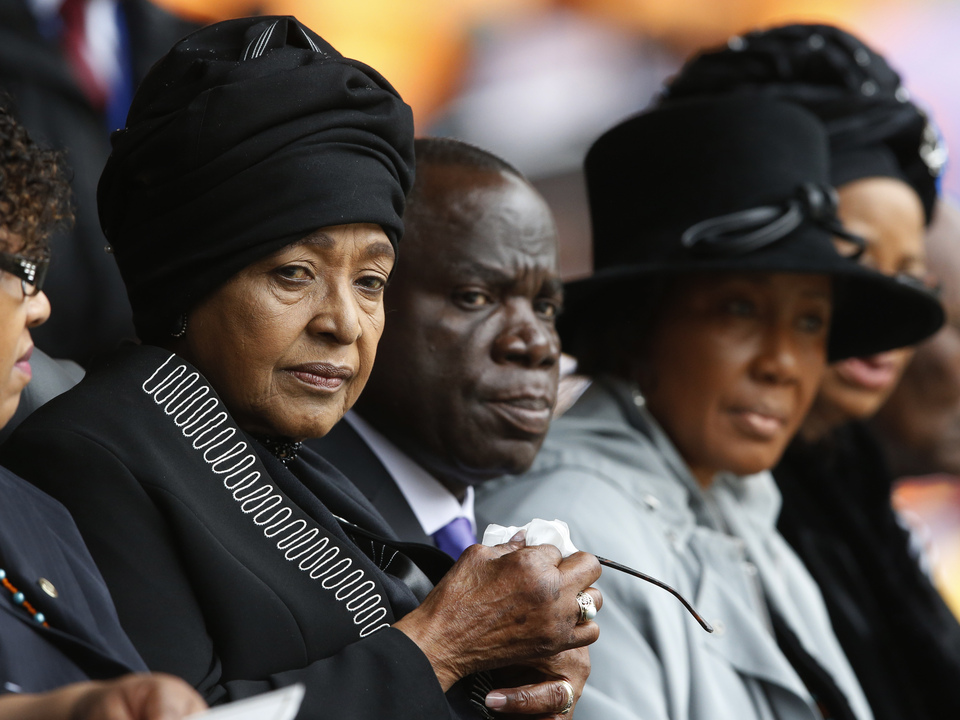Winnie Madikizela-Mandela, left, Nelson Mandela’s former wife, attends the memorial service for former South African president Nelson Mandela at the FNB Stadium in Soweto near Johannesburg, Tuesday.
