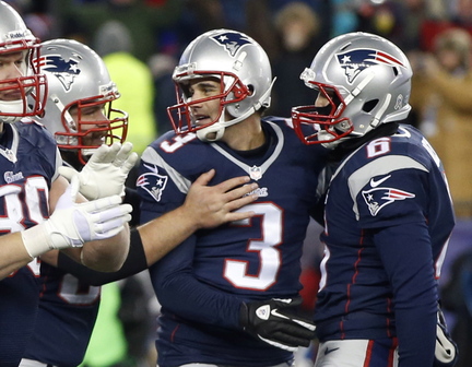 New England Patriots kicker Stephen Gostkowski, center, is congratulated after his game-winning fieldgoal against the Denver Broncos in overtime of an NFL football game early Monday, Nov. 25, 2013, in Foxborough, Mass. The Patriots won 34-3. (AP Photo/Steven Senne)