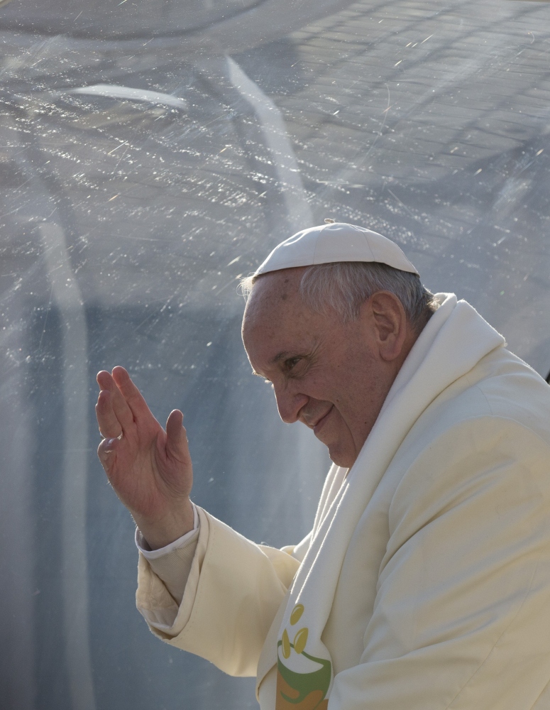 Pope Francis waves as he leaves after his weekly general audience in St. Peter’s Square at the Vatican on Wednesday. Pope Francis has been selected by Time magazine as the Person of the Year.