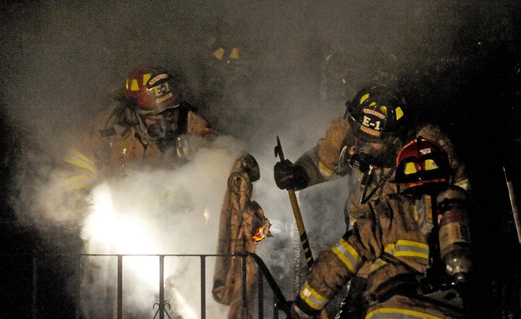 STRUCTURE FIRE: Firefighters from Waterville battle a blaze at 1 Mount Pleasant St. in Waterville on Wednesday night.