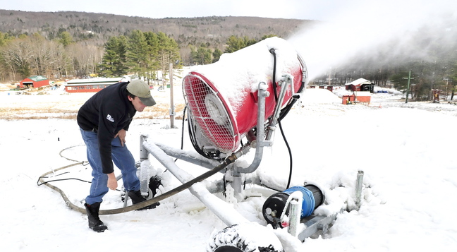 SNOW MAKER: Dave Beers re-directs his snow-making equipment Wednesday as he gets Eaton Mountain in Skowhegan ready for its opening Saturday.