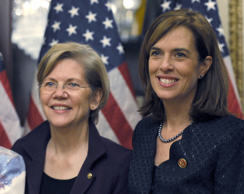 Rep. Katherine Clark, D-Mass., right, stands with Sen. Elizabeth Warren, D-Mass., after Clark posed for a photo Thursday during her ceremonial swearing-in on Capitol Hill in Washington.