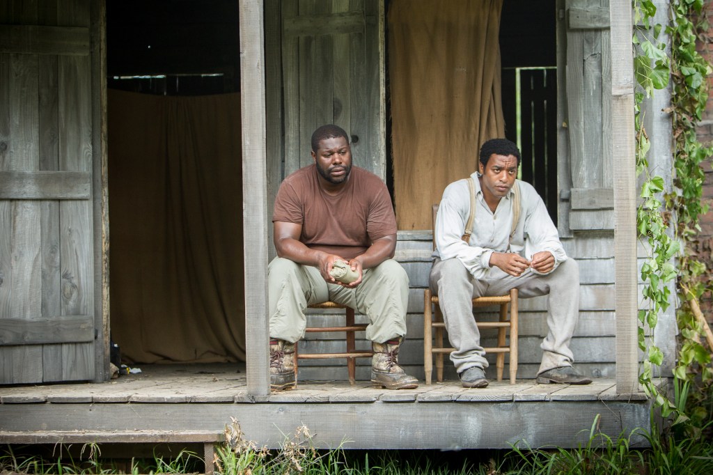 Director Steve McQueen, left, and actor Chiwetel Ejiofor during the filming of “12 Years A Slave.” AP Photo/Fox Searchlight