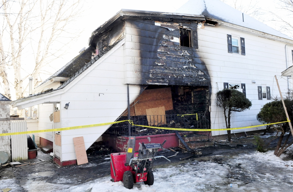 Staff photo by David Leaming DAMAGE: The back portion of this home at 1 Mount Pleasant Street in Waterville is blackened from fire that occurred on Wednesday evening, Dec. 11, 2013.