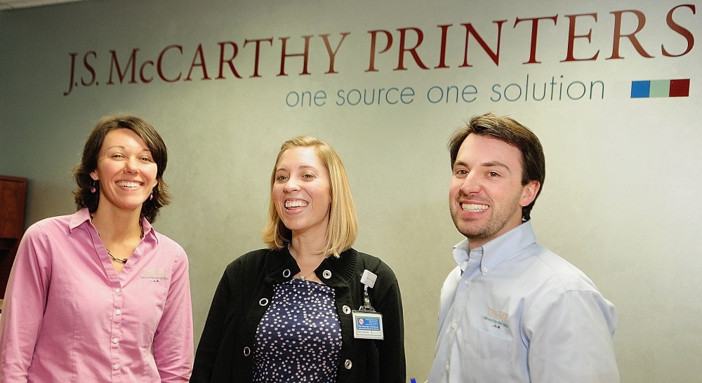 Employer mandate: Melanie Cooper, human resources manager, left, Kristen Simoneau, MaineGeneral health promotion specialist, and Michael Tardiff, director of communications, on Thursday at J.S. McCarthy Printers in Augusta.