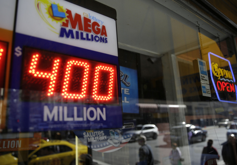 A sign displaying the current Mega Millions jackpot is shown at a Financial District liquor store Thursday, Dec. 12, 2013, in San Francisco. Lottery officials behind Mega Millions say the lesser known game alongside Powerball is grabbing some attention with an estimated $400 million jackpot, an estimated amount that comes less than two months after a major revamp to the game. The estimated jackpot is the fifth largest ever and second largest in Mega Millions history, trailing behind the $656 million Mega Millions jackpot in 2012.