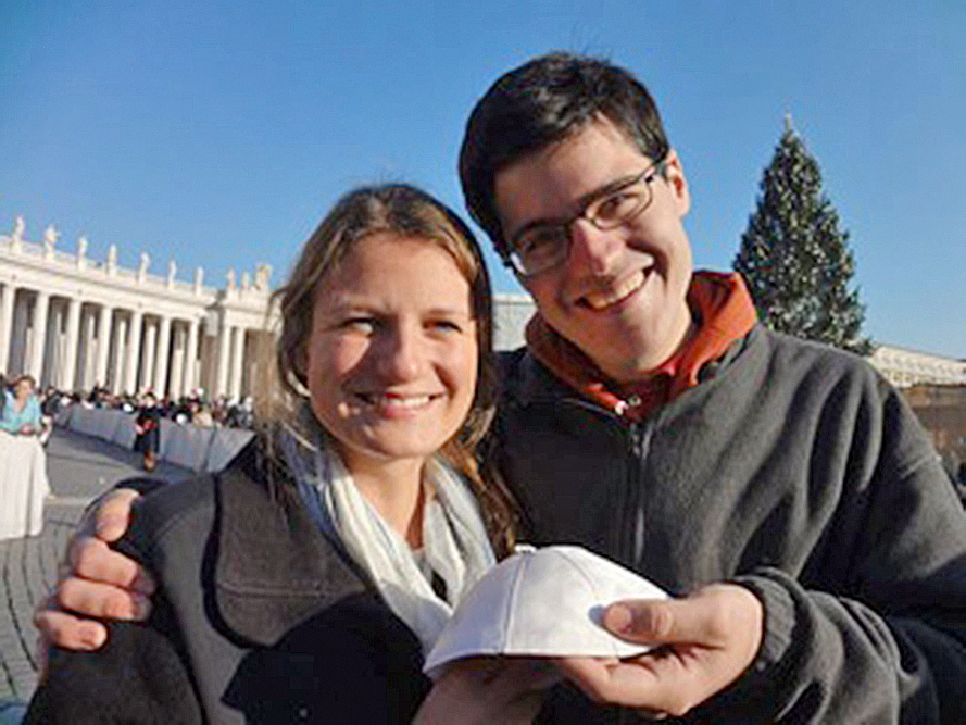Boston College students Katherine Rich and Ethan Mack of Portland hold the pope’s skullcap they received in Rome.