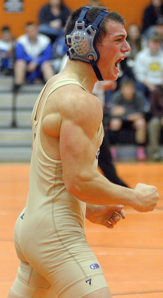 Mount Blue’s Nick Hickey celebrates after beating Cony’s Victor Tapia-Smith in a 160-pound championship semi-finals match during the Tiger Invitational on Saturday December 14, 2013 in the John A. Bragoli Memorial Gym in Gardiner. Hickey eventually pinned his opponent to win in overtime.