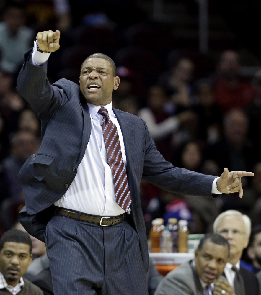 Los Angeles Clippers head coach Doc Rivers reacts during the third quarter of an NBA basketball game against the Cleveland Cavaliers, Saturday, Dec. 7, 2013, in Cleveland. The Cavaliers won 88-82. (AP Photo/Tony Dejak)