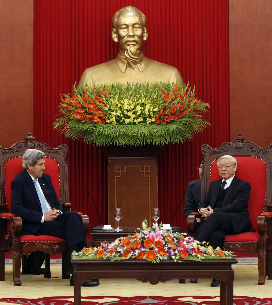 Secretary of State John Kerry meets with Nguyen Phu Trong, general secretary of the Communist Party of Vietnam, in Hanoi on Monday. Kerry pledged up to $18 million in aid to Vietnam, including five fast patrol boats.