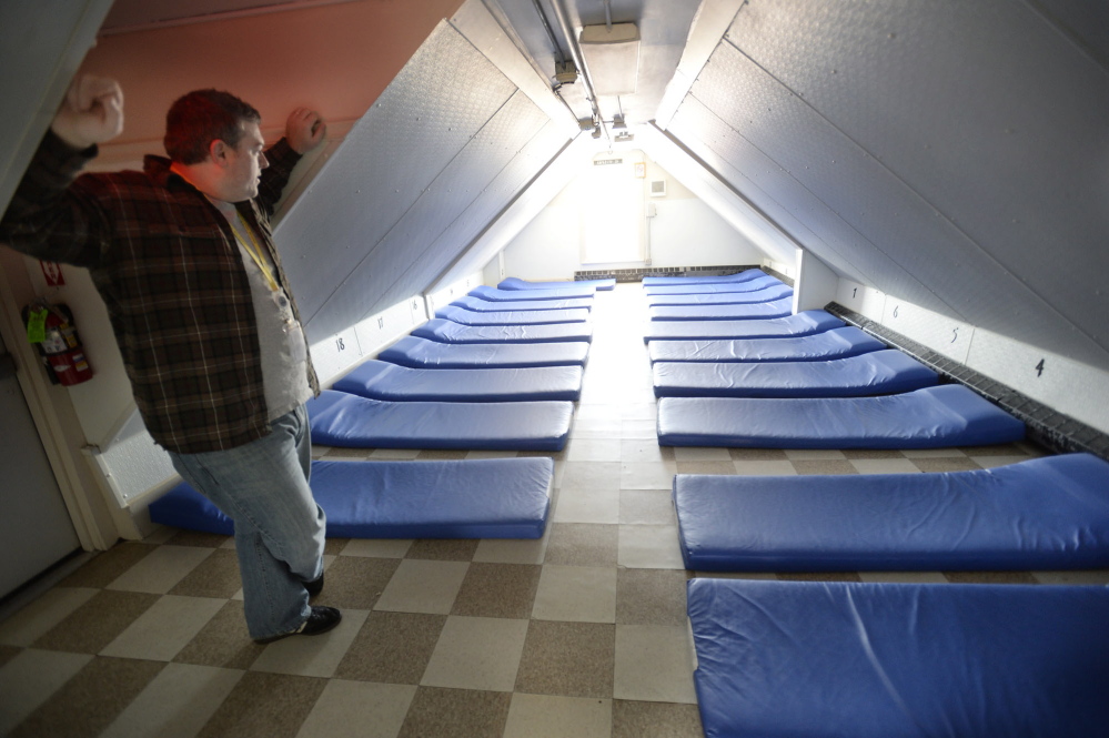 Assistant Director Robert Parritt looks over one of the rooms at the Oxford Street Shelter that often fill up as people come in from the cold in Portland. The shelter can hold about 125 people on any given night.