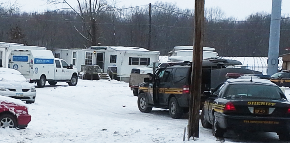 Wayne County sheriff’s deputies secure the scene while investigators from the Ohio Bureau of Investigation search a mobile home in Wayne County’s Green Township on Sunday, Dec. 15, 2013. Jerrod Metsker, 24, was arrested at his home on a murder charge about 12 hours after deputies found the body of Reann Murphy near her home at a mobile park in Smithville, about 30 miles southwest of Akron, Sheriff Travis Hutchinson said. Reann was last seen Saturday night playing outdoors at the park. Officers, firefighters and neighbors joined in the search for Reann, going door-to-door and combing area properties. Hutchinson wouldn’t say how Reann was killed or offer a motive. He described Metsker as a family friend and neighbor.