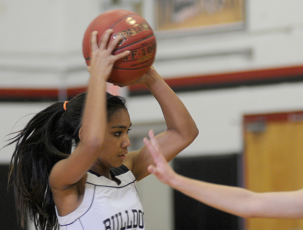 Staff photo by Andy Molloy Madison Area Memorial High School's Tori Mclaughlin, right, blocks Hall-Dale High School's Thea Sweet during a basketball match up Monday in Farmingdale.