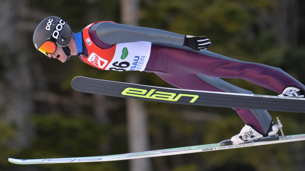 Bryn Fletcher from the United States soars through the air during the Nordic Combined World Cup competition in Ramsau, Austria, on Sunday. He is among those who train at the Utah facility.