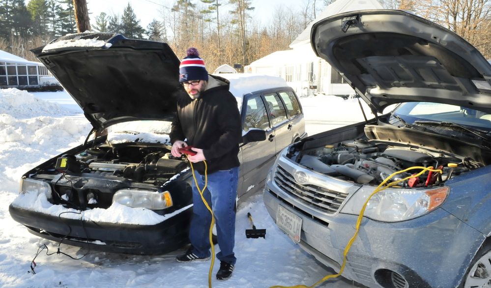 TOO COLD: Below zero temperatures in Skowhegan prevented Job Fitzgerald from starting his car Tuesday, even with the help of a jump start. After repeated attempts Fitzgerald went back inside his warm house.