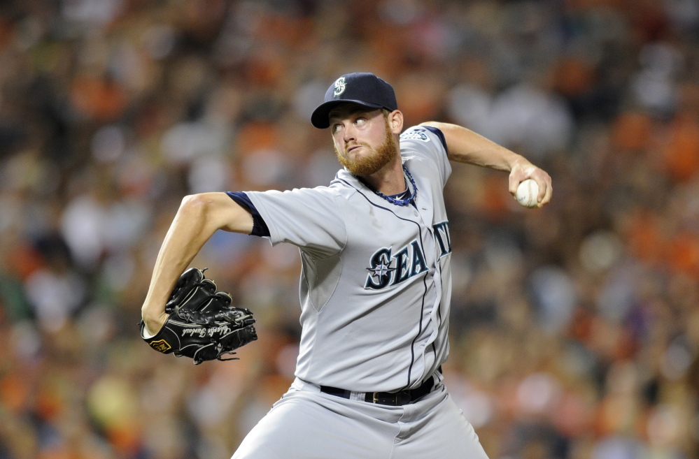 Seattle Mariners relief pitcher Charlie Furbush throws against the Baltimore Orioles during the eighth inning of a game in Baltimore in this Aug. 3, 2013, photo.