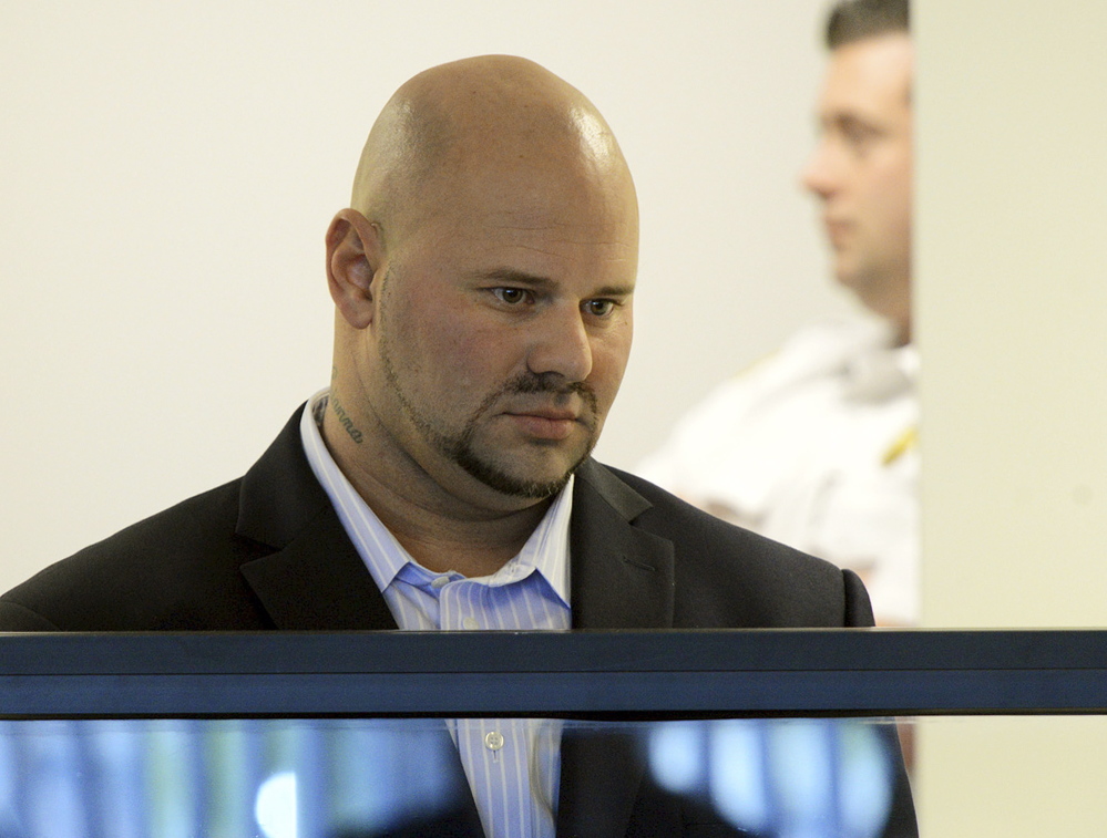 Jared Remy, son of Boston Red Sox broadcaster Jerry Remy, stands during arraignment in October at Middlesex Superior Court in Woburn, Mass., on murder and assault charges in the death of Jennifer Martel.