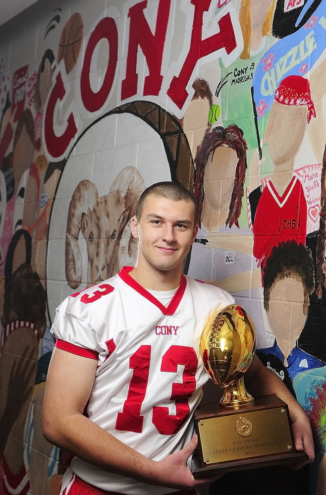 Staff photo by Joe Phelan 2013 Kennebec Journal Football Player of the Year Ben Lucas poses for a photo in front of Ramses mural on Friday December 6, 2013 at Cony High School in Augusta.