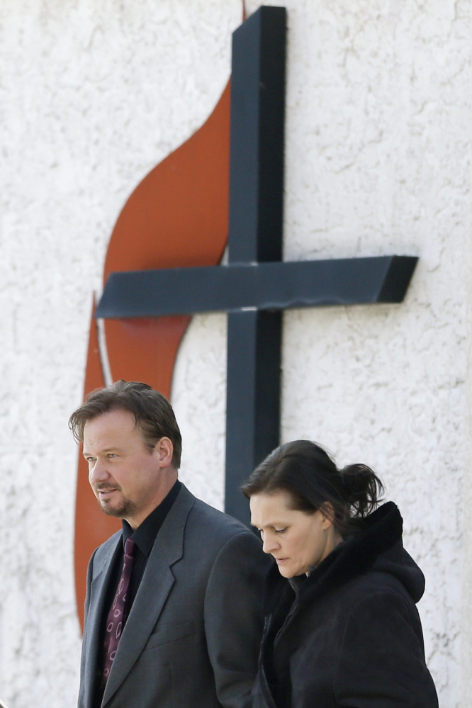 Accompanied by his wife Brigitte, right, the Rev. Frank Schaefer, of Lebanon, Pa., departs after a meeting with officials at the Eastern Pennsylvania Conference of the United Methodist Church on Thursday in Norristown, Pa. He planned to hold a news conference Thursday afternoon at a Methodist church in Philadelphia where an associate minister was defrocked in 2005 for being in a lesbian relationship.