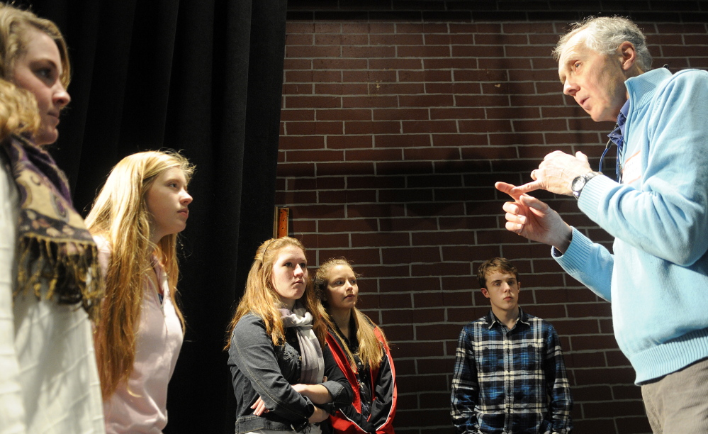 CONNECTED TO CULTURE: Larry Morissette directs choral students at Hall-Dale High School in Farmingdale. The singers were rehearsing two songs that were composed by Stan Keach, of Rome, and feature two Maine icons, Donn Fendler and Bean Boots by LL Bean.