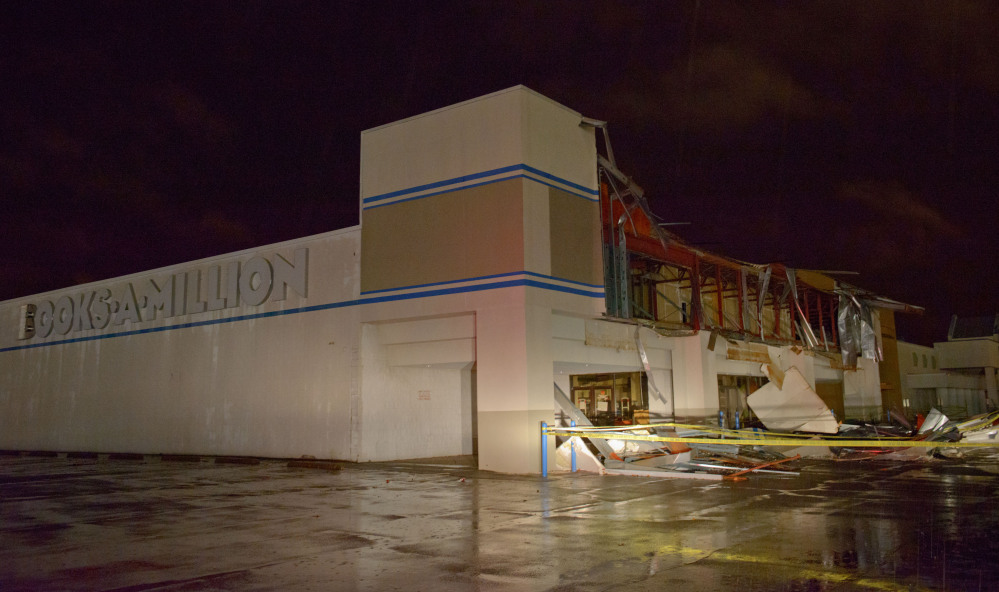 The Books-A-Million store is seen damaged by heavy wind and rain during a major storm in Monroe, La., Saturday, Dec. 21, 2013.