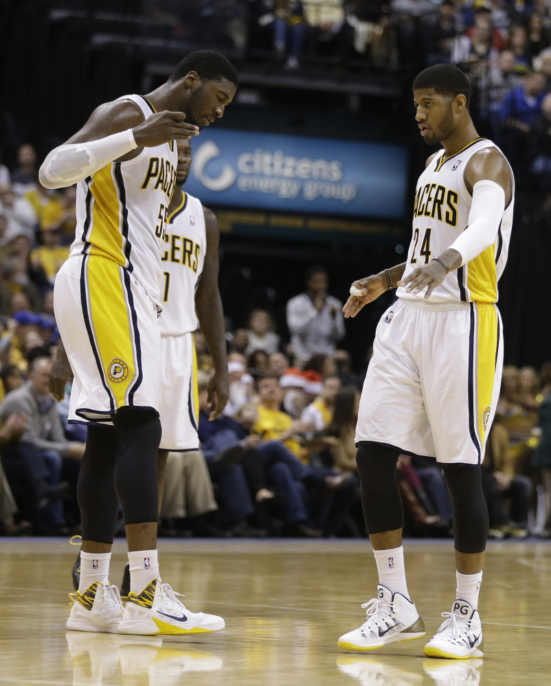 WINNING STUFF: Roy Hibbert, left, Paul George and the Indiana Pacers are one of just three teams in the NBA’s Eastern Conference on pace to finish over .500 this season. Miami and Atlanta are also on pace for a winning record.
