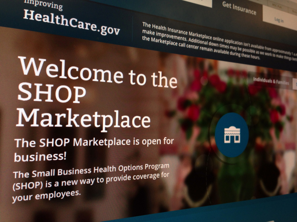 This Nov. 27, 2013 file photo of part of the HealthCare.gov website page featuring information about the SHOP Marketplace is photographed in Washington. Although multiple problems have snarled the rollout of President Barack Obama’s signature health care law, it’s hardly the first time a new, sprawling government program has been beset by early technical glitches, political hostility and gloom-and-doom denouncements.