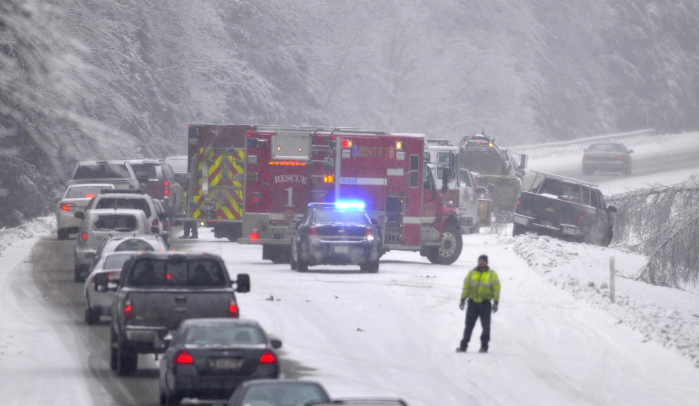 Staff photo by Michael G. Seamans STORMY TRAVEL: A multi-vehicle accident snarled traffic on the northbound lanes on Interstate-95 on the Sidney and Waterville on Thursday, Dec. 26, 2013. Snow has complicated matters in central Maine with residents still dealing with the ice storm that paralyzed much of central Maine this week.
