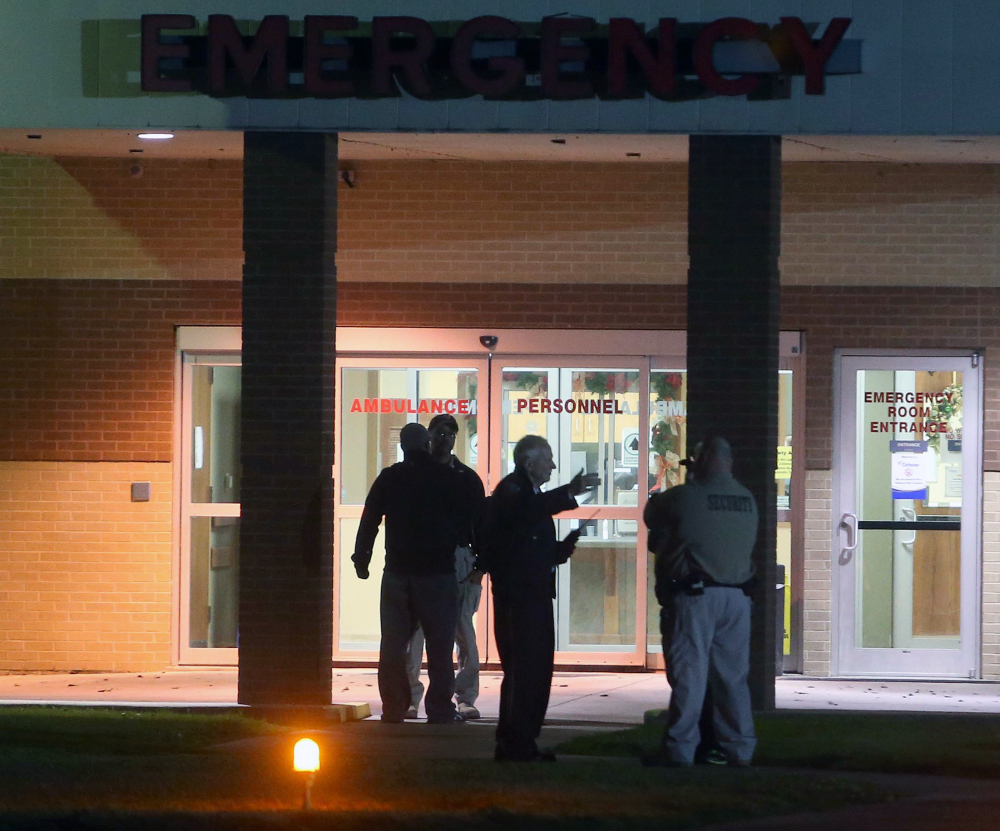 Security personnel stand outside Ochsner St. Anne Hospital in Raceland, La., one of three hospitals placed on lockdown after Ben Freeman went on a shooting rampage in four locations in two parishes in south Louisiana on Thursday.