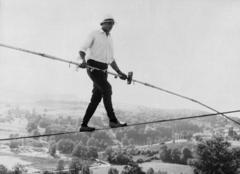 French tightrope walker Henri Rechatin walks over the Saint-Remy sur Durolle countryside in central France, in this July 16, 1967 file photo, as he breaks the specialty’s world record of the time. The celebrated French tightrope walker known as Henry’s, who balanced above high the Alps, the Grand Canyon and Niagara Falls, died on Friday, aged 82, the mayor of his home town of St Etienne announced Saturday.