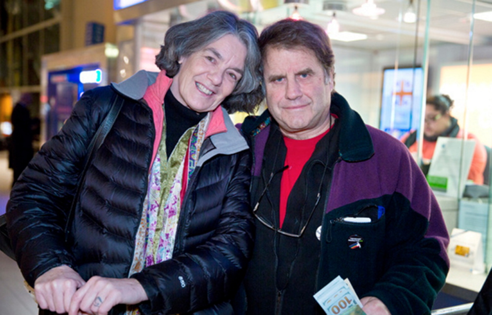 Maggy Willcox and her husband, Peter, pose after their arrival Friday night at Logan International Airport in Boston. Peter Wilcox had been imprisoned by Russia for two months after being arrested during a protest at a Russian oil rig in the Arctic in September.