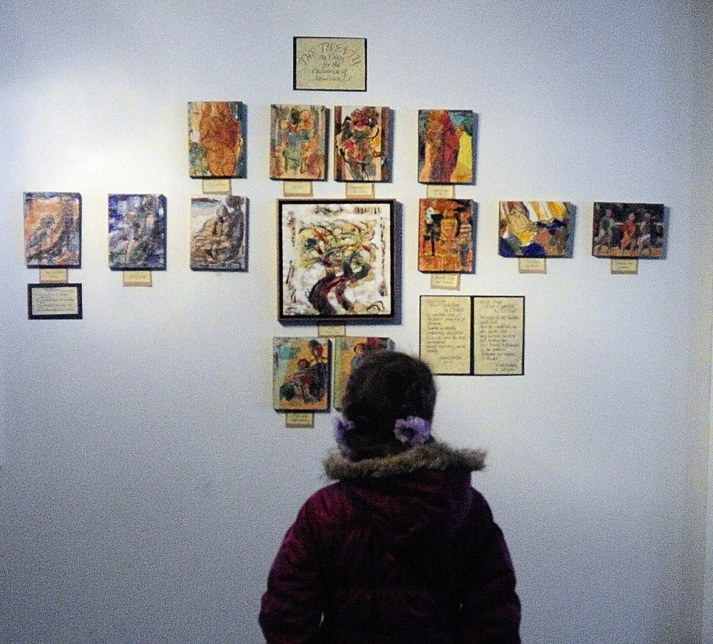 A CHILD”S VIEW: Maya Kucharski, 9, of Sidney, looks at the art display on Sunday December 29, 2013 in the Alexander Nevsky Parish Hall, 28 Kimball St., in Richmond.