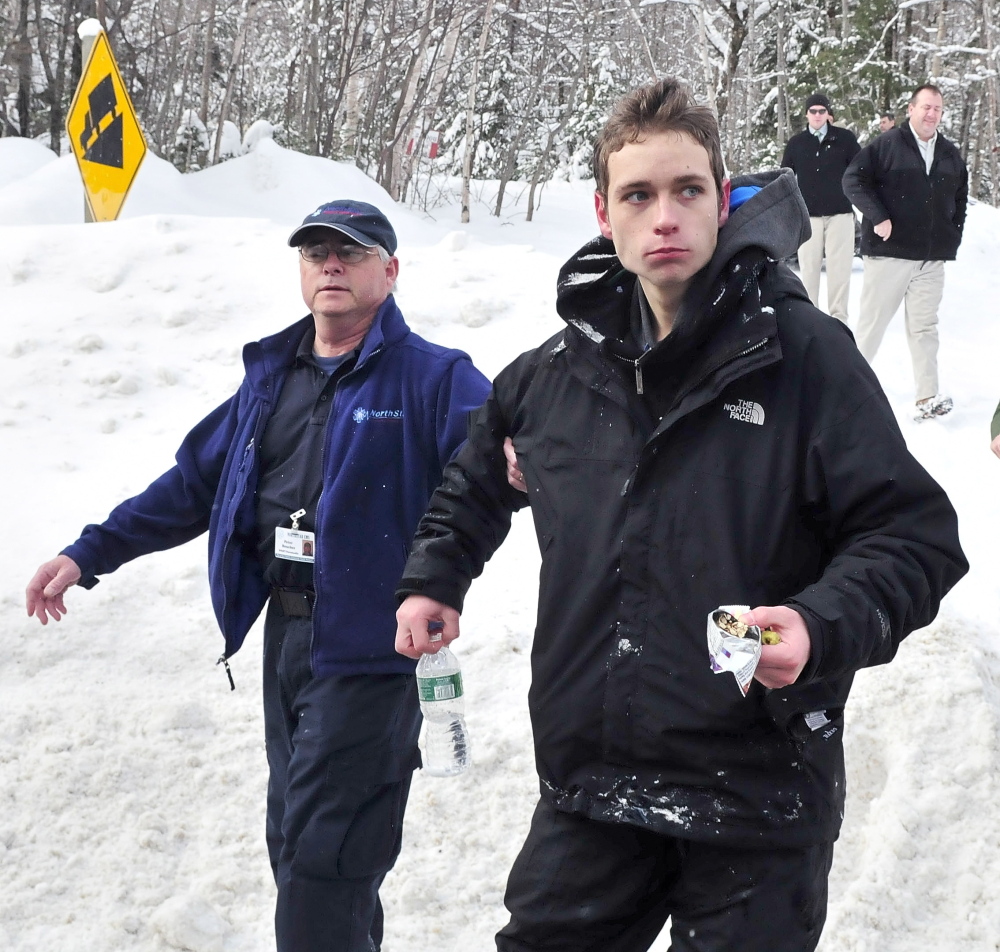 Missing skier: Nicholas Joy, 17, of Medford, Mass., is led to an ambulance in March after spending two nights lost near Sugaloaf ski area.